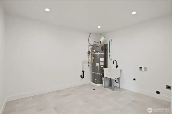 Big downstairs mechanical/laundry room w/sink & lots of storage room.