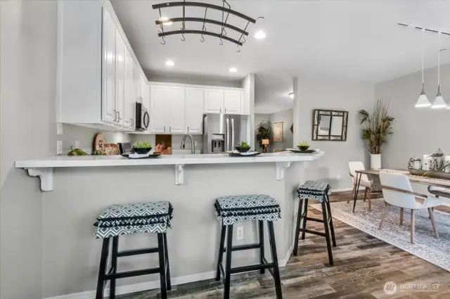 Are they helping more by sitting on the stools or washing the dishes?