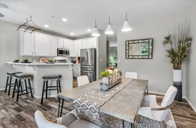 The kitchen has stainless steel appliances and a breakfast bar. It will be light and bright on the grayest days.