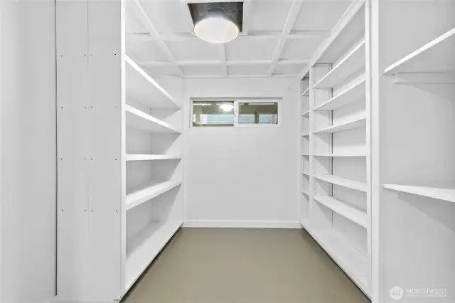Lower-level storage room with new paint, lighting and flooring.
