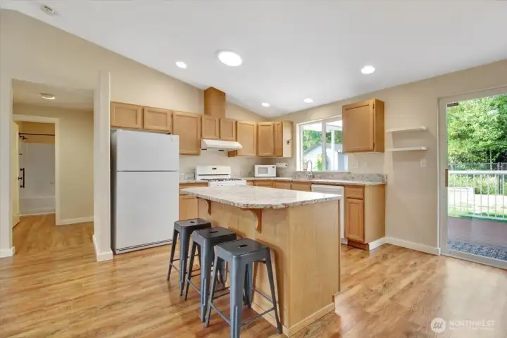 Breakfast bar plus adjoining dining area.
