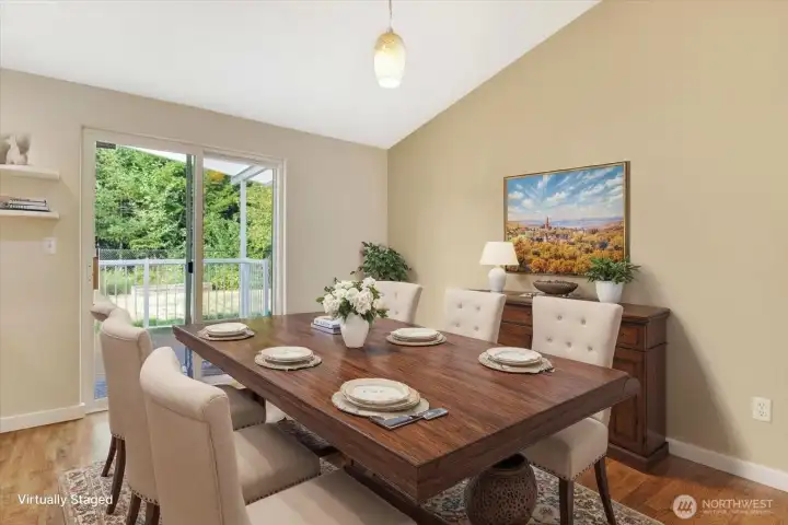 Dining room opens up to the backyard. (Virtual staging).
