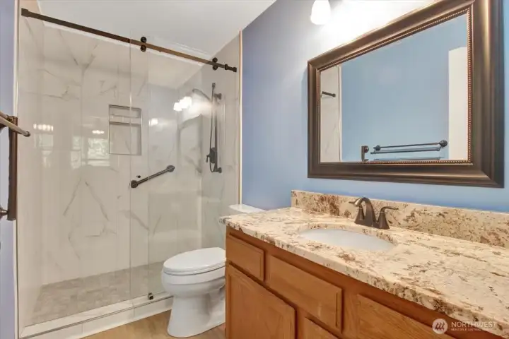 Primary bathroom with walk-in shower.