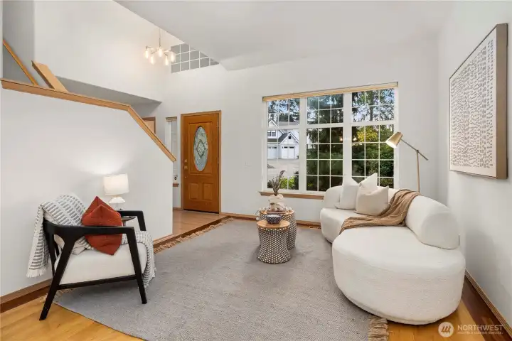 Bright and airy living space featuring stunning hardwood floors and an open layout.
