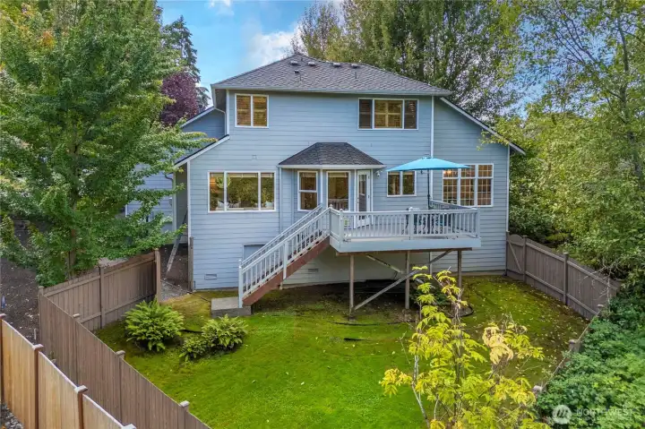 Private deck overlooking the serene backyard—ideal for relaxing or hosting guests.