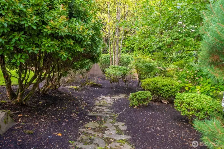 Wander through lush greenery on thoughtfully designed paths that meander throughout the property.