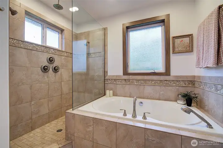 Huge walk in shower with three shower heads