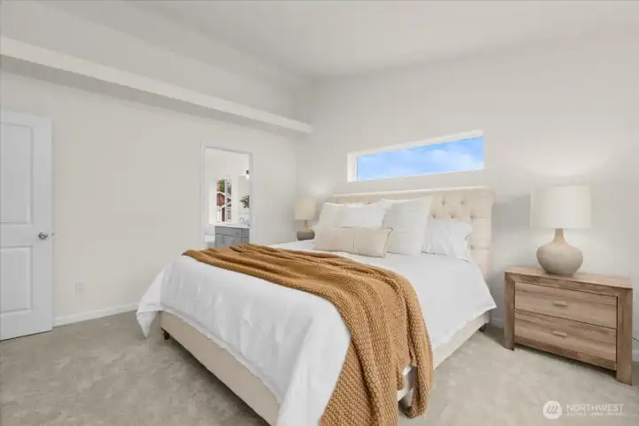 Seamless flow from the primary bedroom into the luxurious 5-piece bathroom.