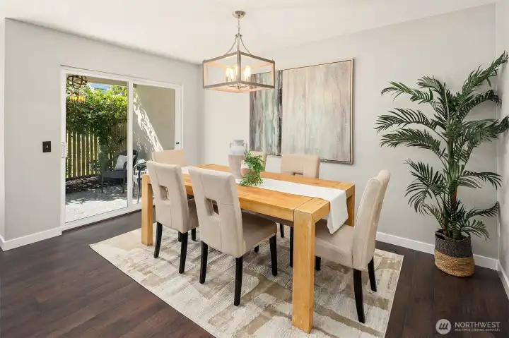 Large dining area opens to backyard.