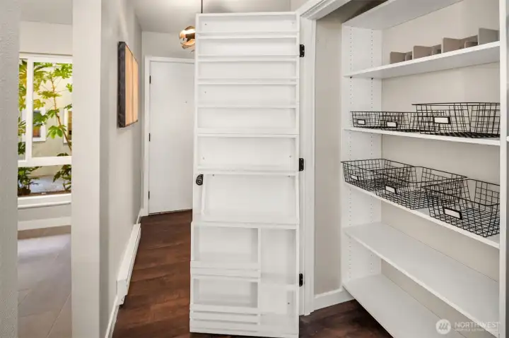 Large pantry with organization off kitchen.