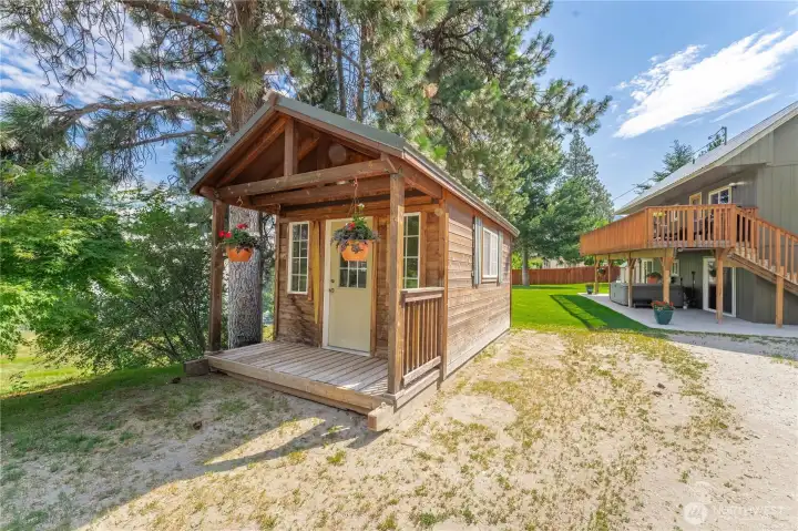 Detached storage shed & driveway entrance.
