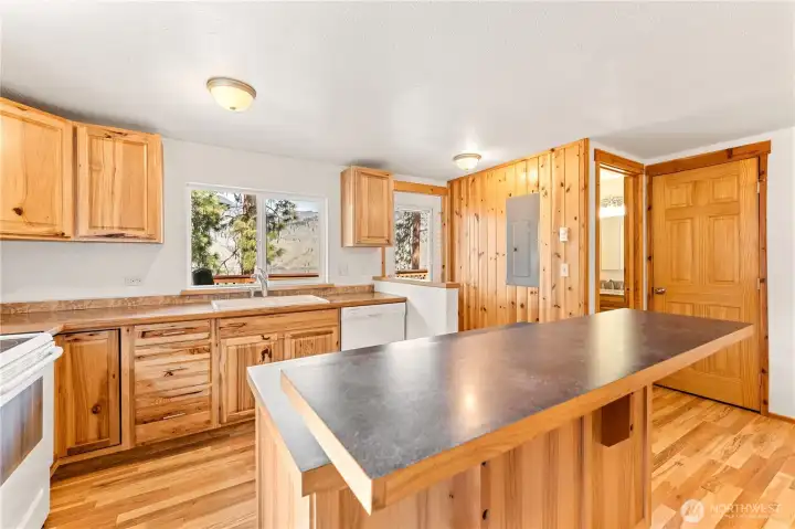 Upper Level Kitchen - View towards powder room and door leading to upper level view deck with outdoor living area.