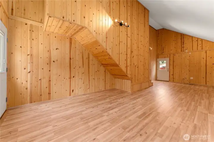 Lower Level Great Room looking towards back door leading to landscaped yard and lawn area.