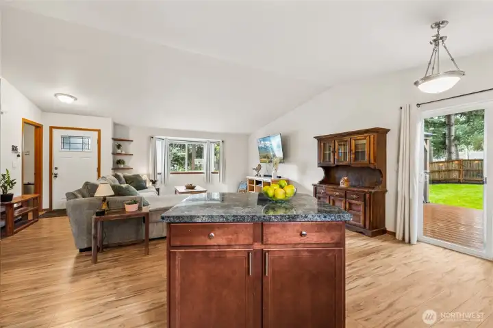 The kitchen island provides extra prep space and a natural gathering spot for guests. Pull up a stool, it’s perfect for morning coffee, casual meals, or catching up while cooking.