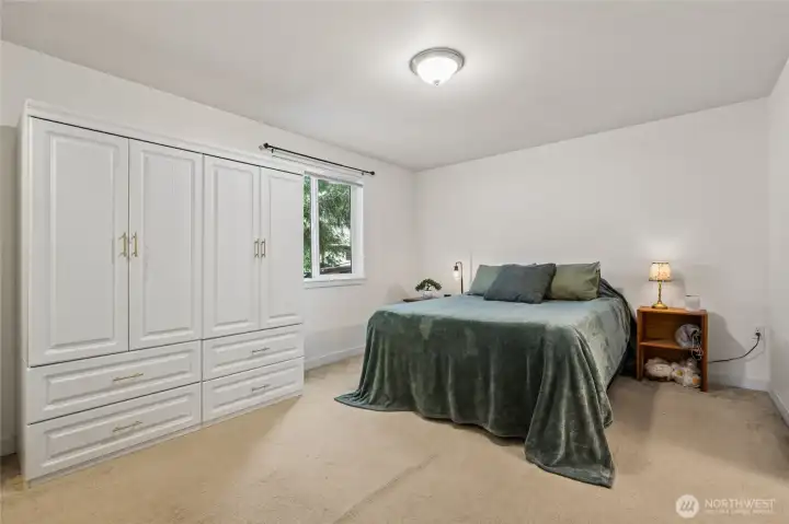 The large primary bedroom is designed for everyday comfort, giving you space to relax and stay organized. Its private full bath and walk-in closet make daily living simple and efficient. The detached wardrobe can stay for Buyer as a convenience to seller.