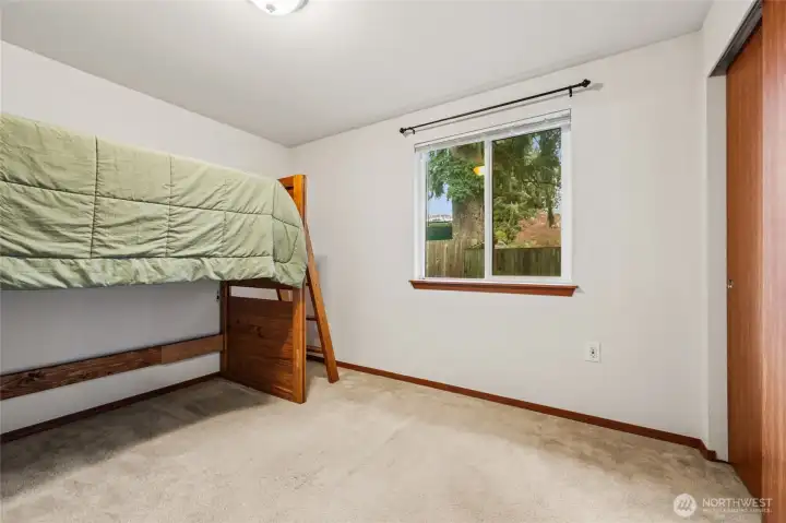 Bedroom #3; Another comfortable bedroom provides space for family, work, or creative pursuits.
