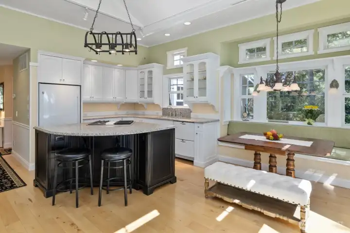 Kitchen with Gas Range, an Island, and a Dining Nook