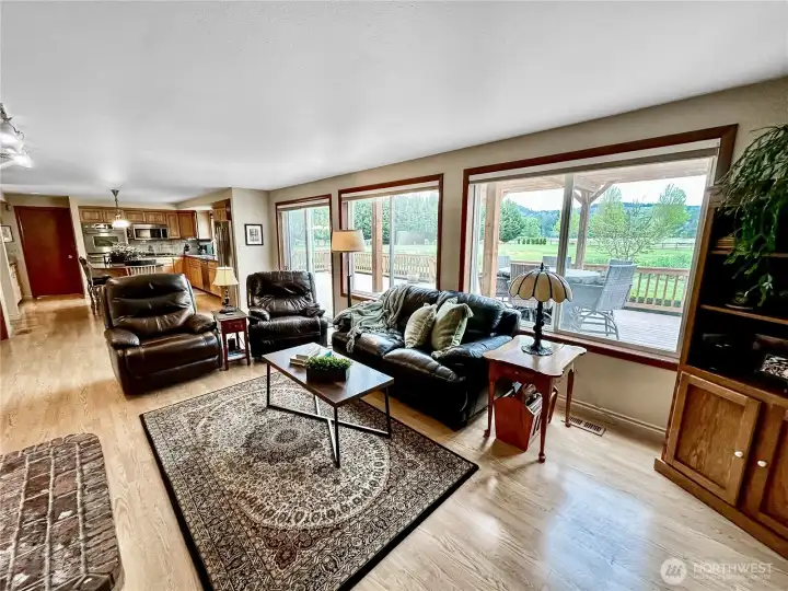 Another family room view...you will love the slider that opens to the large composite deck with pergola and breathtaking territorial views.