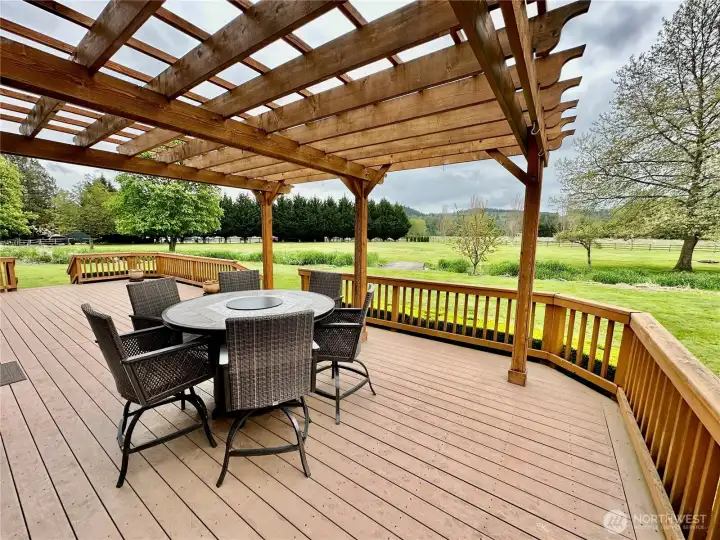 Rear composite deck with pergola and plenty of room for entertaining.  You will love the view...making this the perfect place to watch the seasons change all year long.