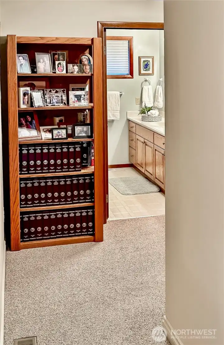 This shows the hall access to the main floor bedroom wing and full bath.  This home has so much storage with lots of extra closets.