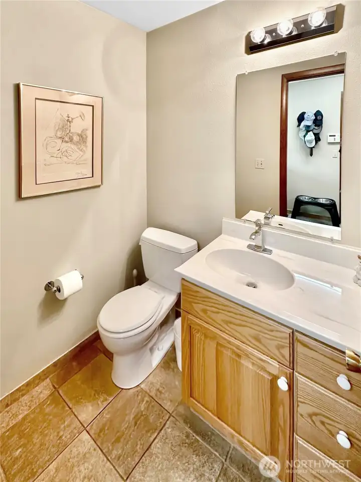 Main floor powder bath located just off the laundry room.