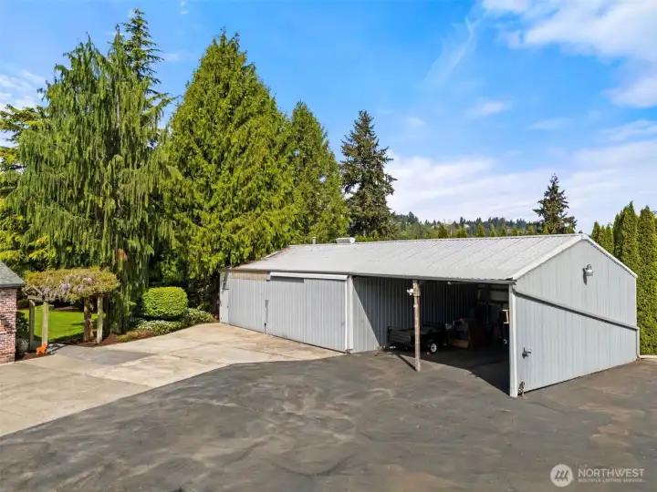 Detached garage/shop with loft with power and heat plus 2 car carport.