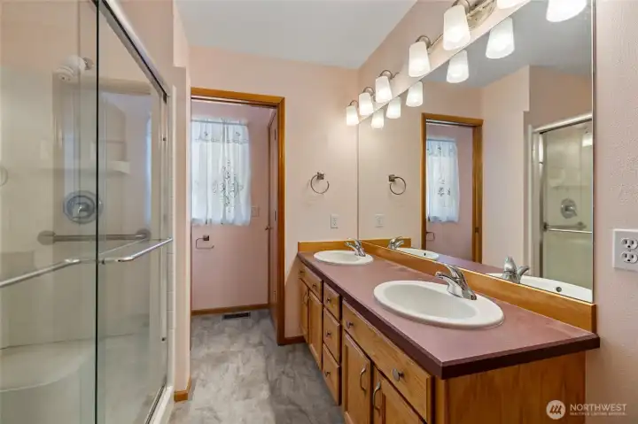 Primary bath with dual sink vanity and oversized walk-in shower