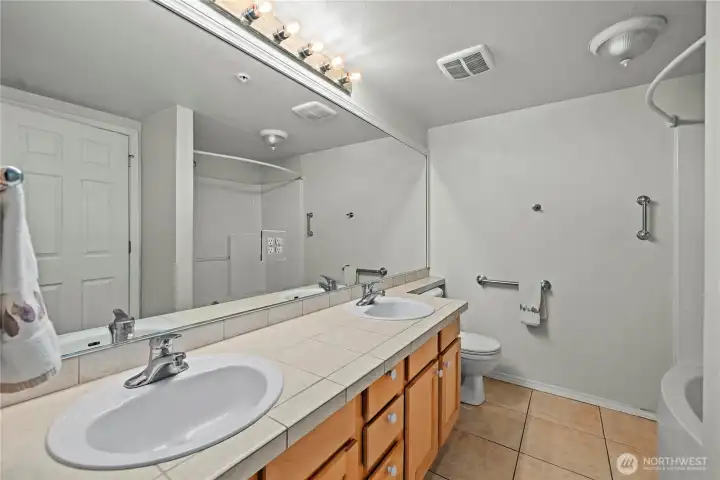 Maple cabinets, Dual sinks, tile counters and floors and designer grab bars for safety. Maple cabinets, Dual sinks, tile counters and floors and designer grab bars for safety.