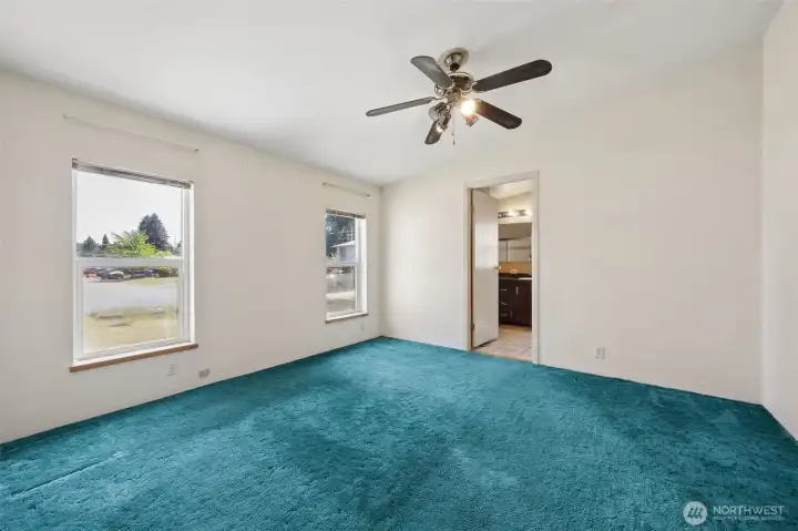 Primary suite with walk in closet. Split floor plan separates the primary bedroom from secondary bedrooms.