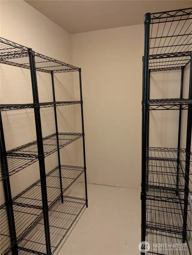 This storage room is located outside of the condo in the hallway. Not all condos have this added storage.