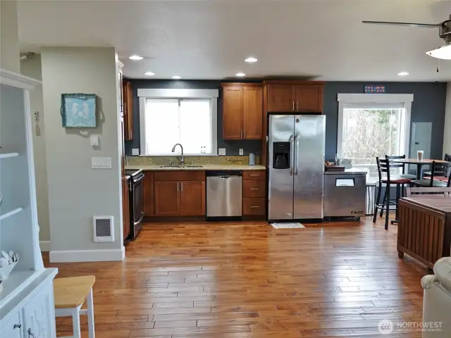 Open Great Room w/ gorgeous hardwood floors.