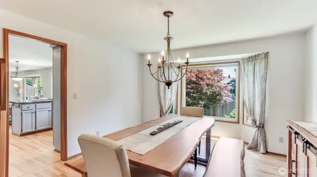 Open layout with access to the large formal dining room from the front room, great for entertaining. Enjoy newly installed hardwood floors too!