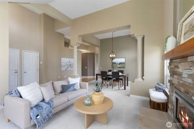 A view through the living/dining rooms, showcasing stunning architectural details and designer colors.