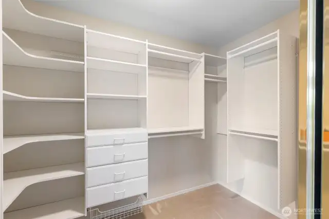 HUGE walk-in closet with all the cabinetry you'll need!