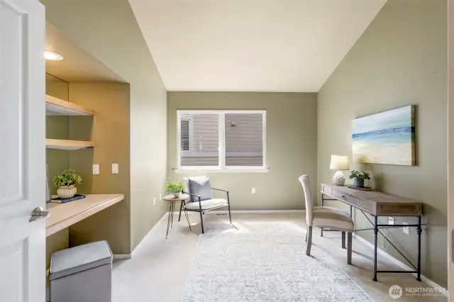 The sunny office/den enjoys a built-in work area handy for work or play.