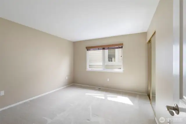 The spacious second bedroom has a large closet and is perfect for guests or hobbies.