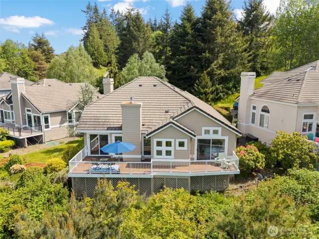 The west-facing deck stretches across the back of the home, perfect for enjoying those amazing sunsets!
