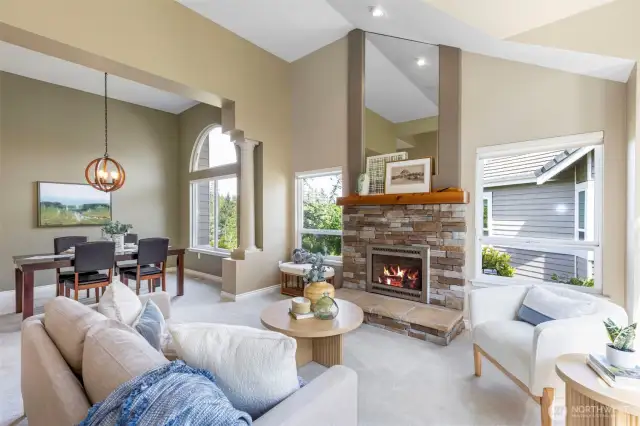 The living area enlarges as it opens into the dining room! Craftsman-inspired stone fireplace is perfect for those chilly northwest evenings.