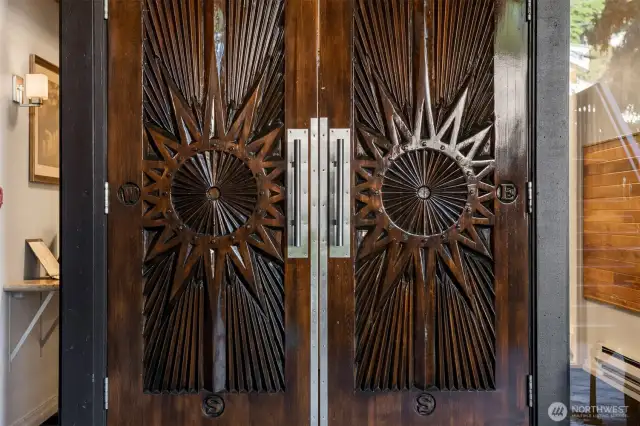 Beautiful Mid-Century Carved doors welcome you home.