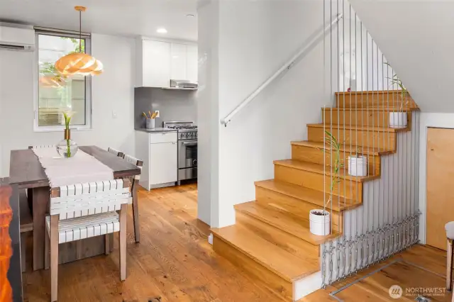 Let's go up!  Note, basement storage in floor to the right of stairs as well as under stair storage