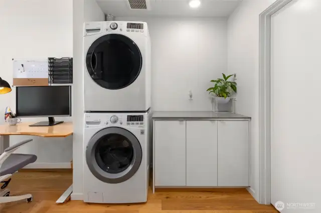 2nd washer/dryer adjacent to desk area in wide hallway