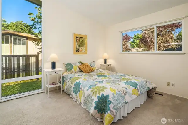 The bedroom in the southeast corner. Tons of light and plenty of space in these rooms. Vaulted ceilings really make these spaces sing.