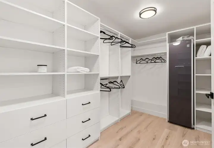 GIANT walk in closet, complete with automatic garment steamer.