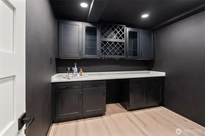 2nd hidden room with wine storage and a large beverage fridge. Elevate your entertaining game!