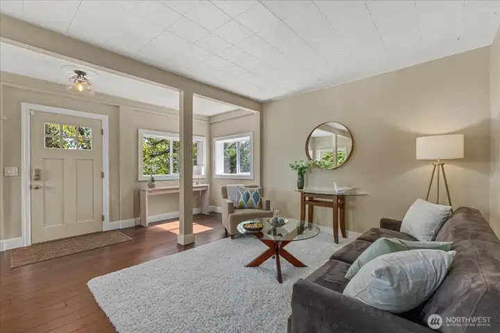 This large light filled space is perfect for welcoming guests, three sides of windows this is a lovely room in all weather