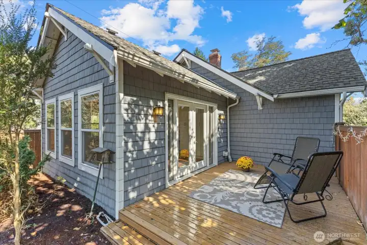 This deck is private and comfortable...steps down lead to a large fully fenced backyard