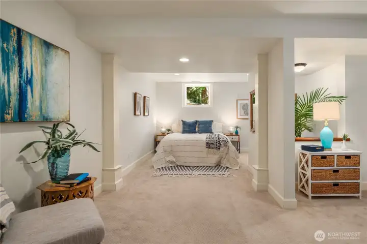 This lower-level space functions beautifully as a bedroom or bonus room, offering a bright, comfortable retreat with flexible layout options.