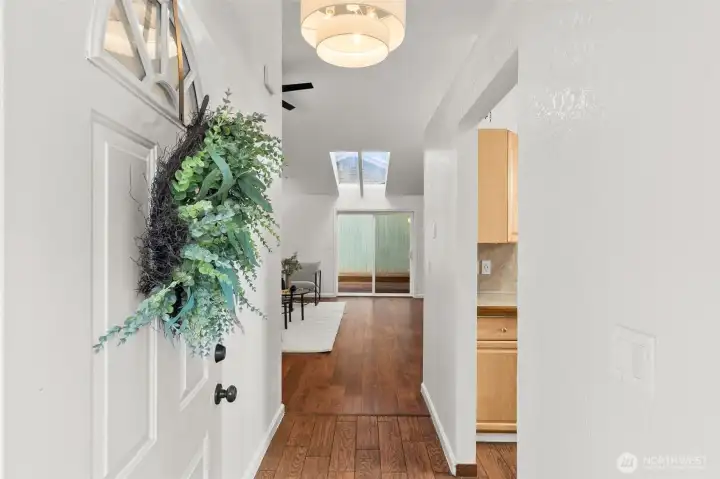 Front entry takes you to a vaulted living room - tons of light and updated flooring.