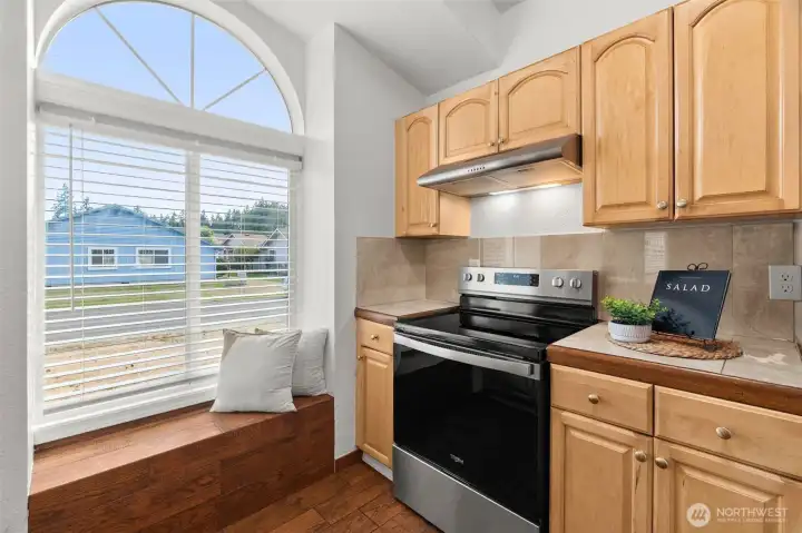 Brand new stove - and a charming window nook.
