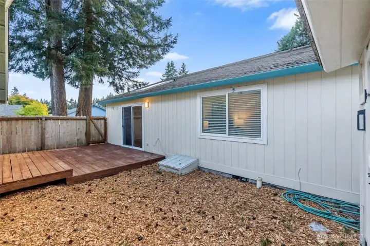 Exterior, fully fenced backyard. The perfect spot for morning coffee and starting that raised bed garden you have always wanted.